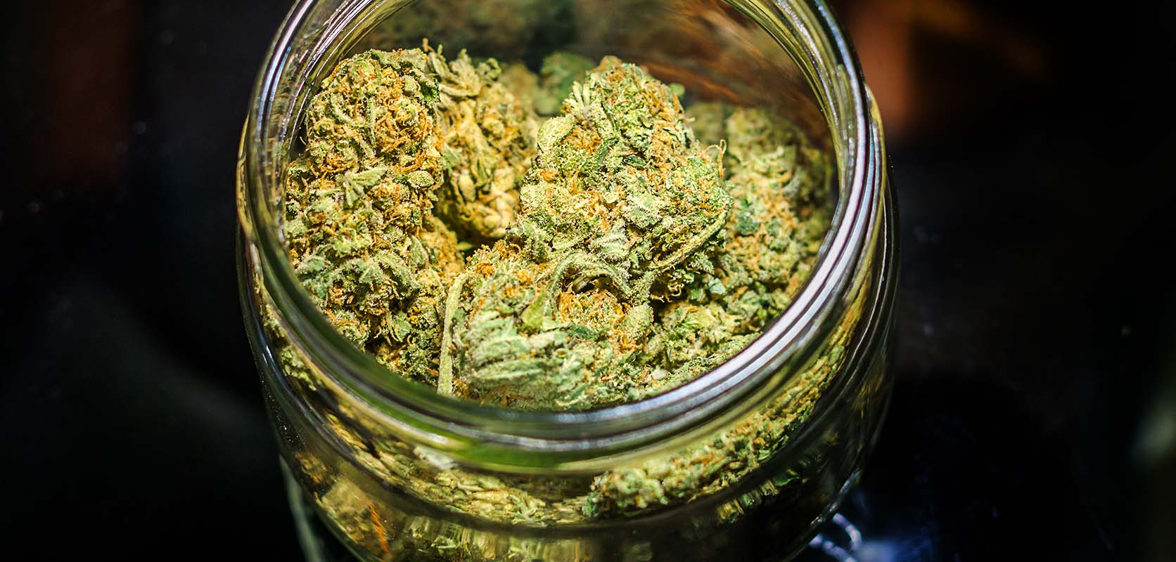 Photo of cannabis nugs in a jar. purchase weed online at low price bud online dispensary for cheap weed.