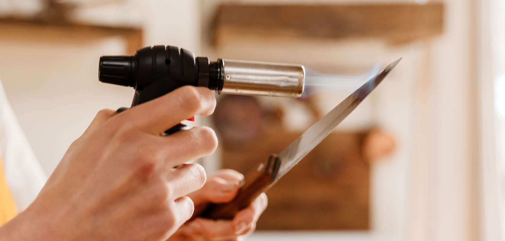 photo of hash smoker heating a knife. how to smoke hash. where to buy weed online in canada.