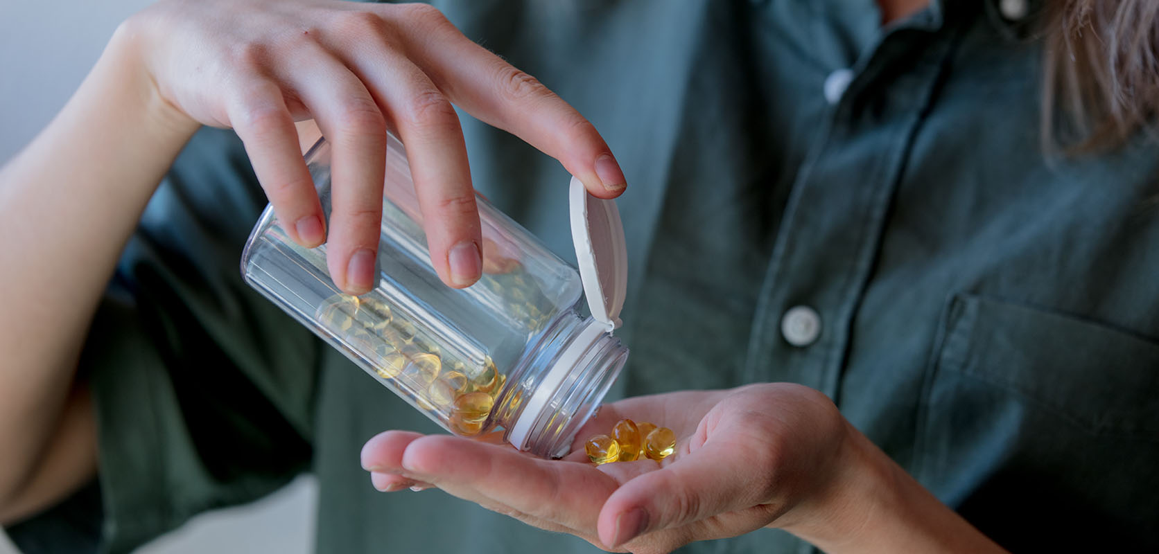 Woman taking thc distillates in capsule form. buy weed online in canada.