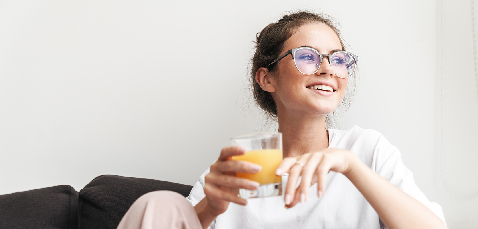 lady drinking orange juice at home after smoking jelly breath strain. order weed online. mail order weed. online weed dispensary. buy weed online. 