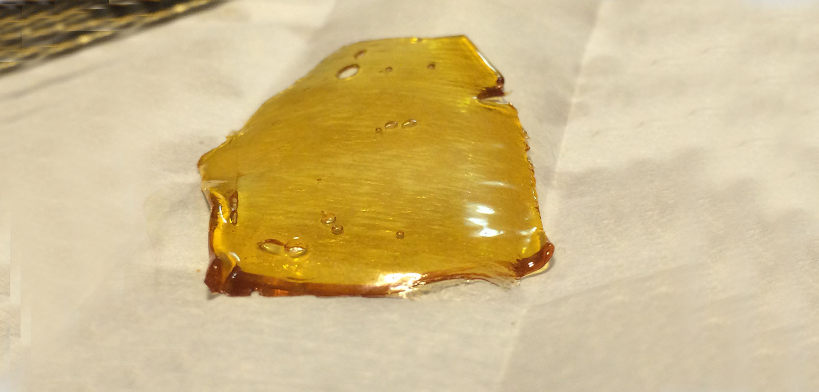 Photo of shatter cannabis concentrate. Buy weed online in Canada.