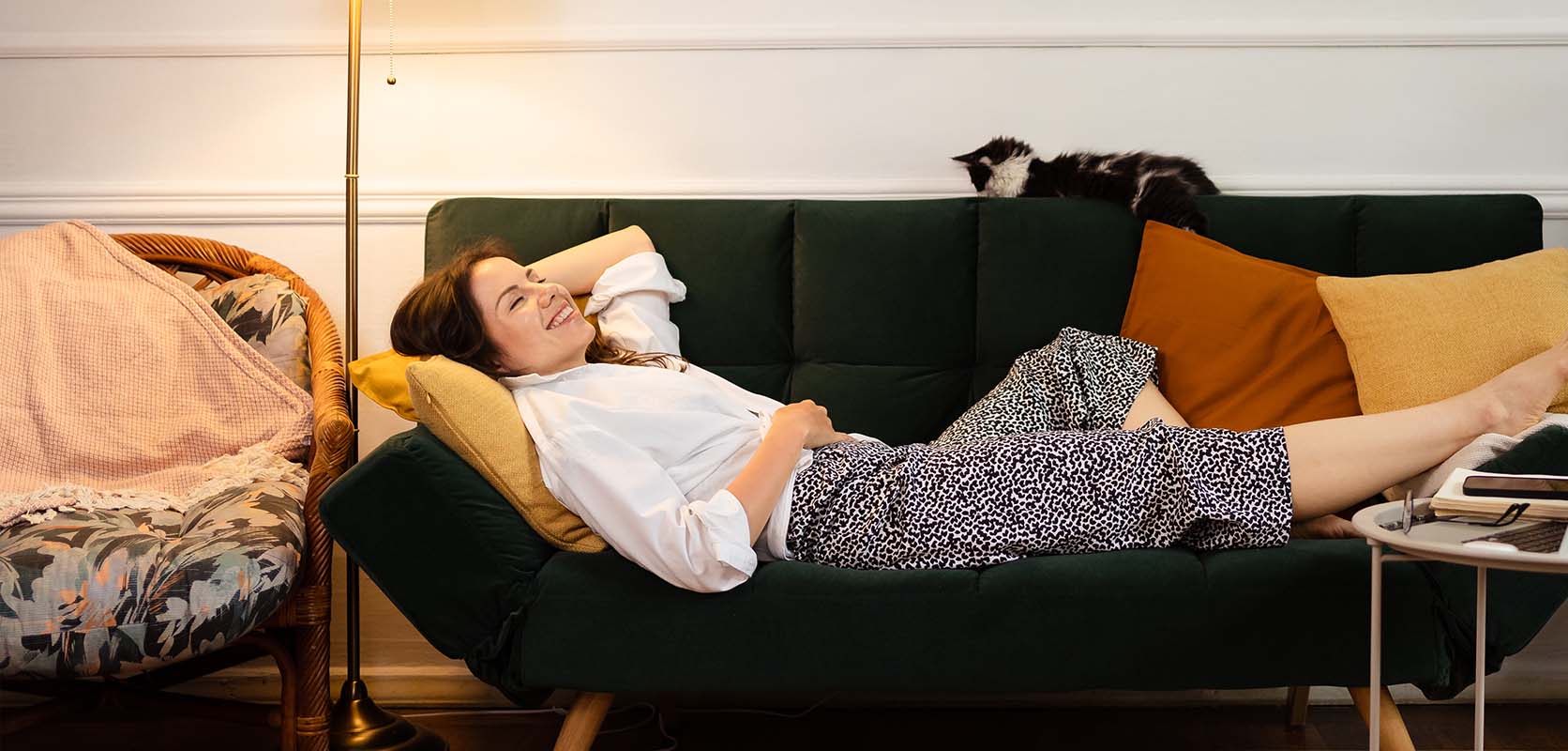 Relaxed female laying on her sofa at home after buying death cookie strain weed online in Canada.