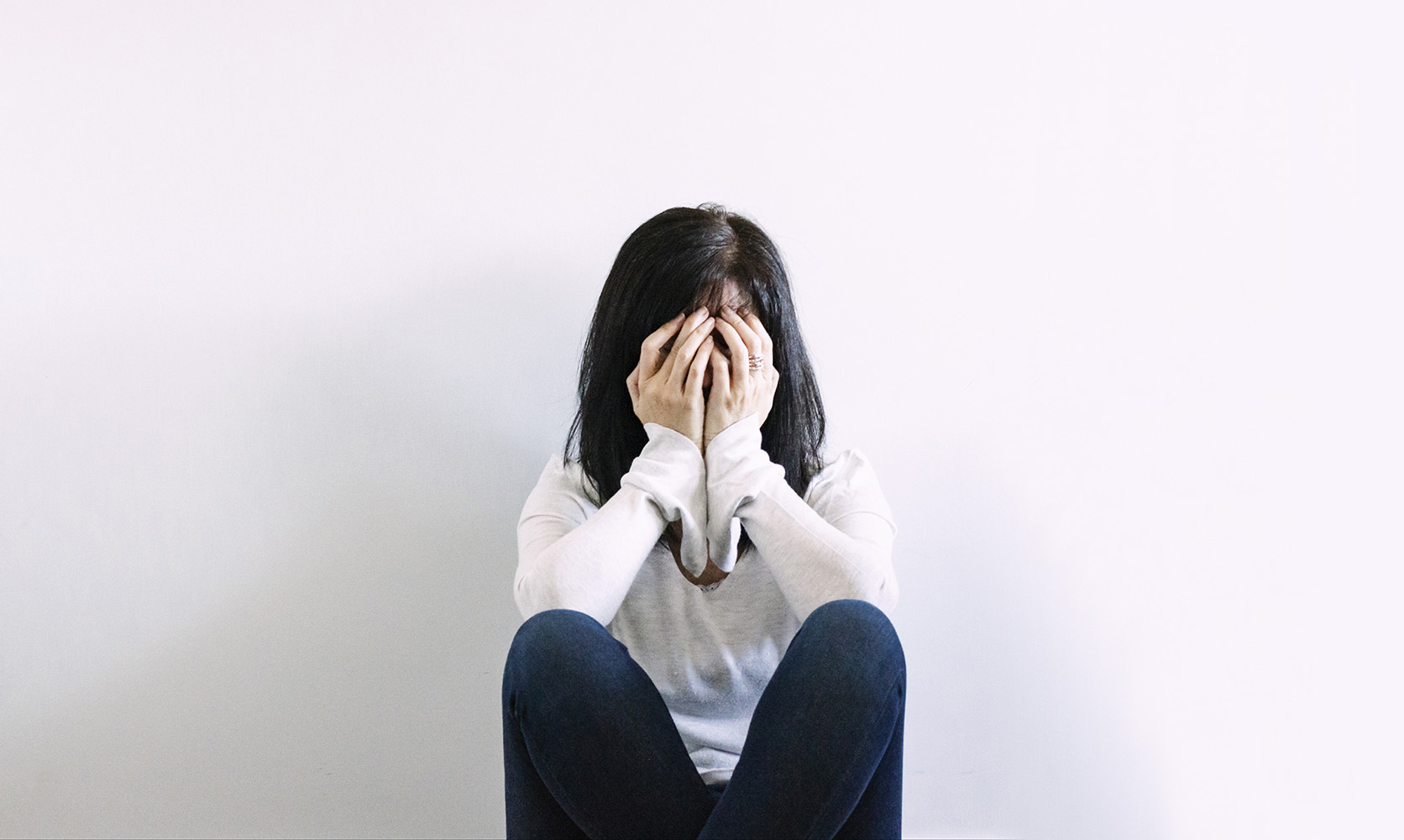 covering her face. Weed for anxiety. online dispensary Canada.