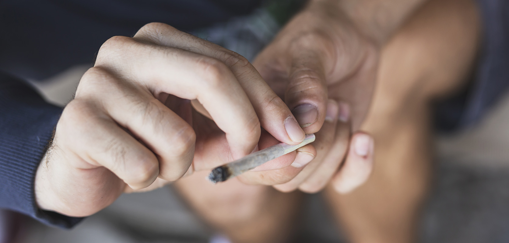 Passing a joint to a friend using proper weed etiquette. buy weed from weed dispensary for BC cannabis and cannabis canada.