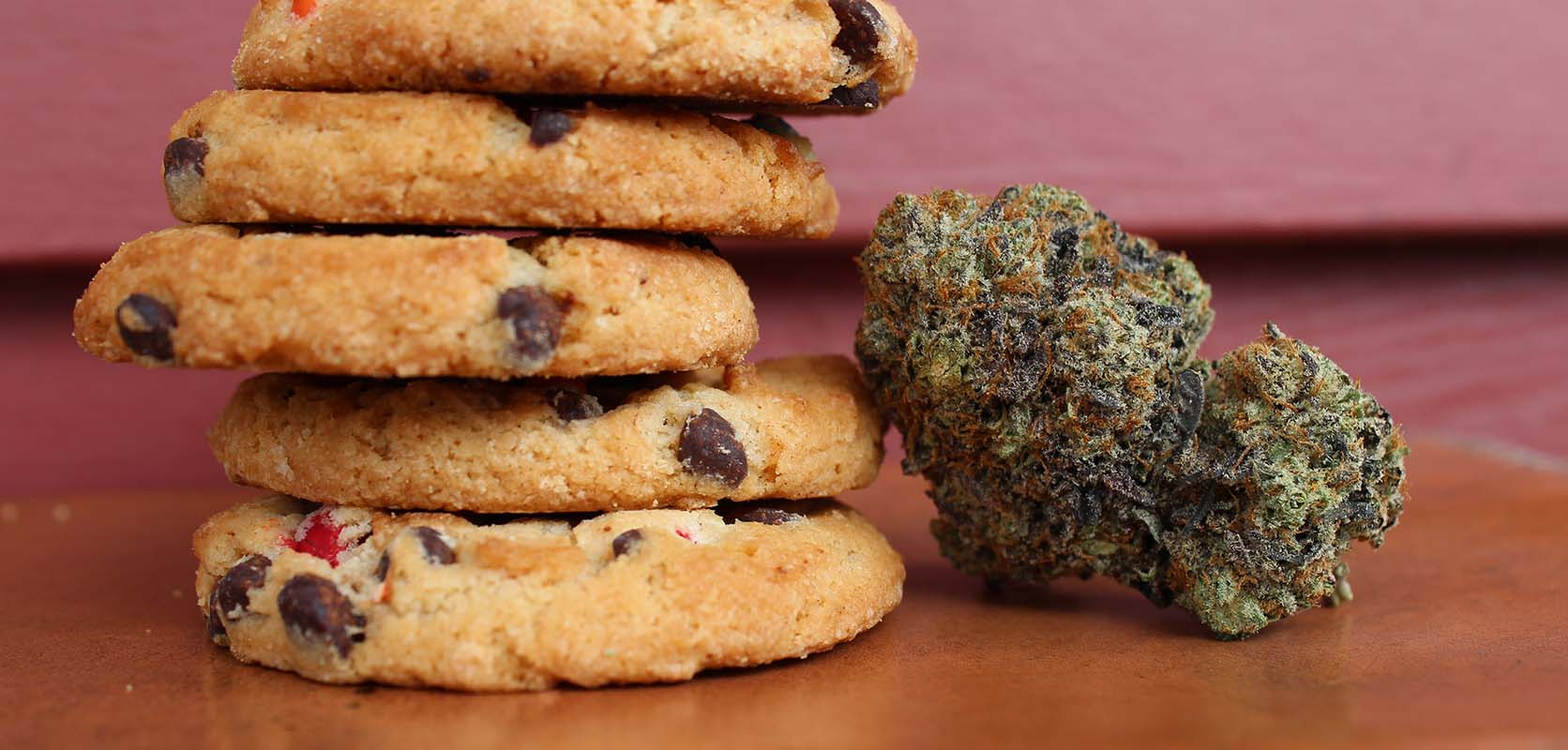 Weed chocolate chip cookies next to a budget bud of weed from Low Price Bud online dispensary Canada for mail order marijuana, edibles, shatter, and weed online Canada.